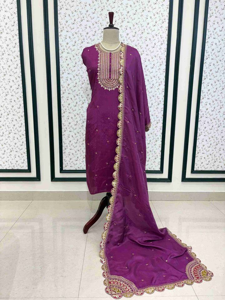 Complete purple embroidered unstitched suit set with kurta, dupatta, and bottom on manequinn