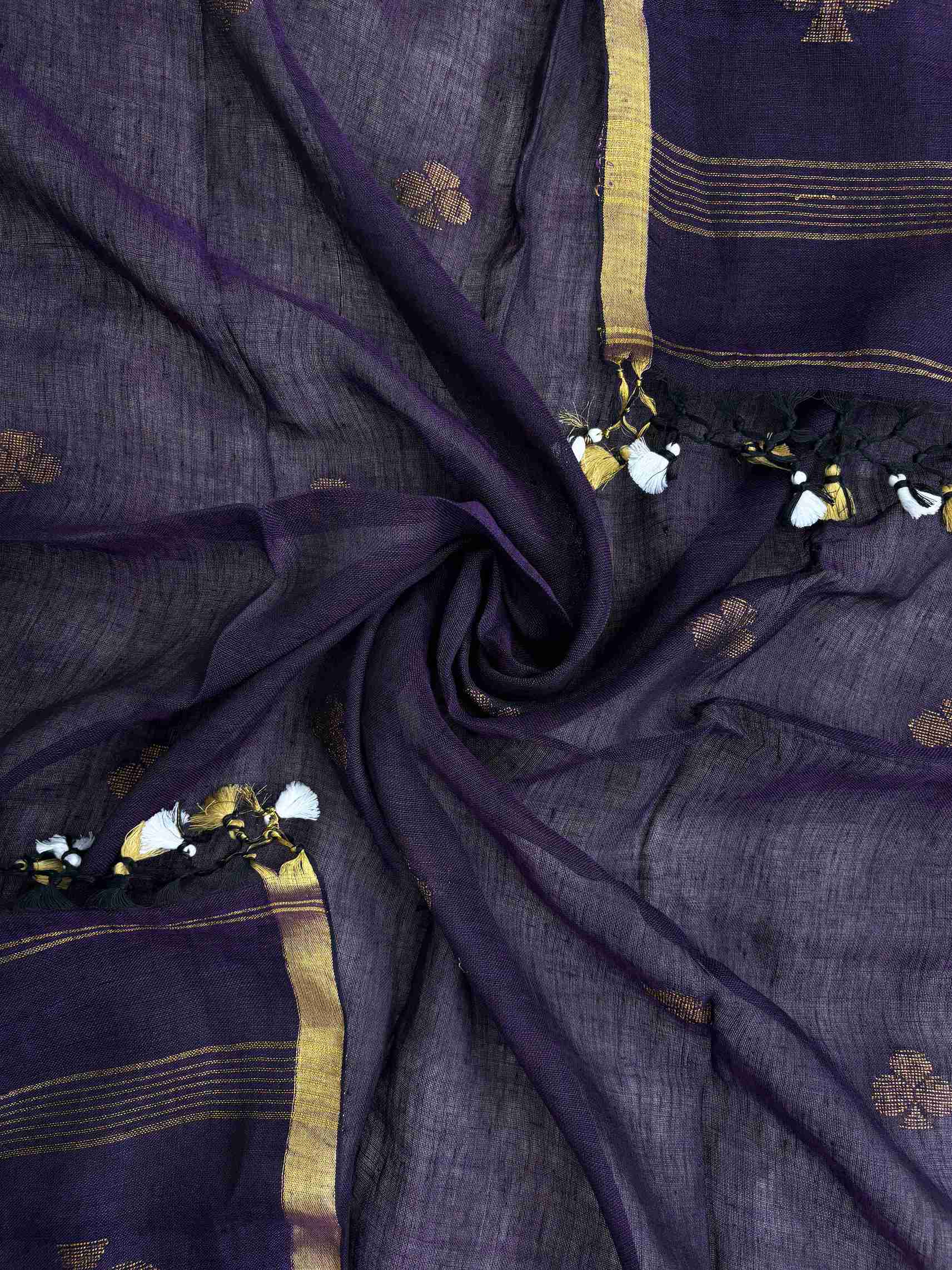 Scattered golden geometric spade woven motifs across purple handloom linen dupatta surface