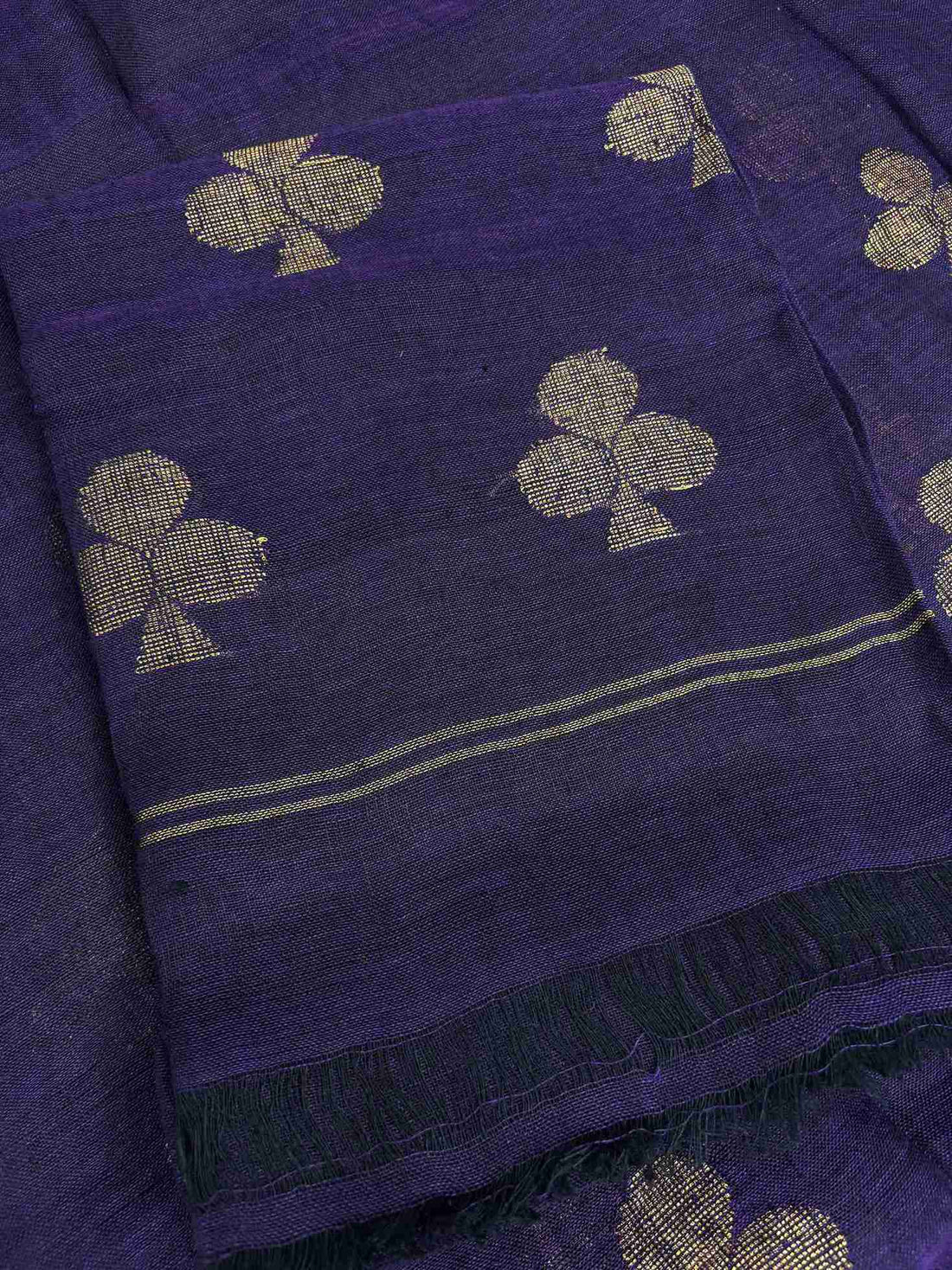 Natural slub texture and organic weave of purple handloom linen shirt fabric close-up