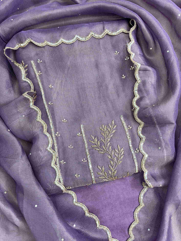 Front view of purple burberry tissue suit with intricate sequence and nalki work