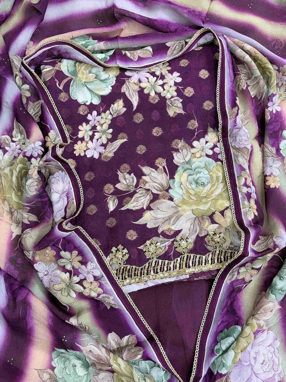 Close-up of all-over digital floral print in contrasting colors on purple muslin shirt