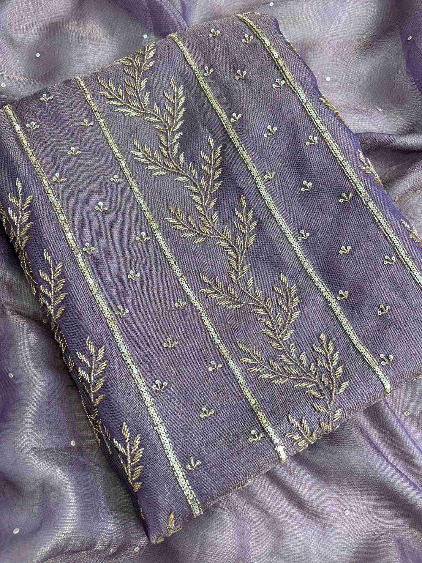 Close-up of purple suit featuring detailed nalki, sequence and cutdana hand embroidery