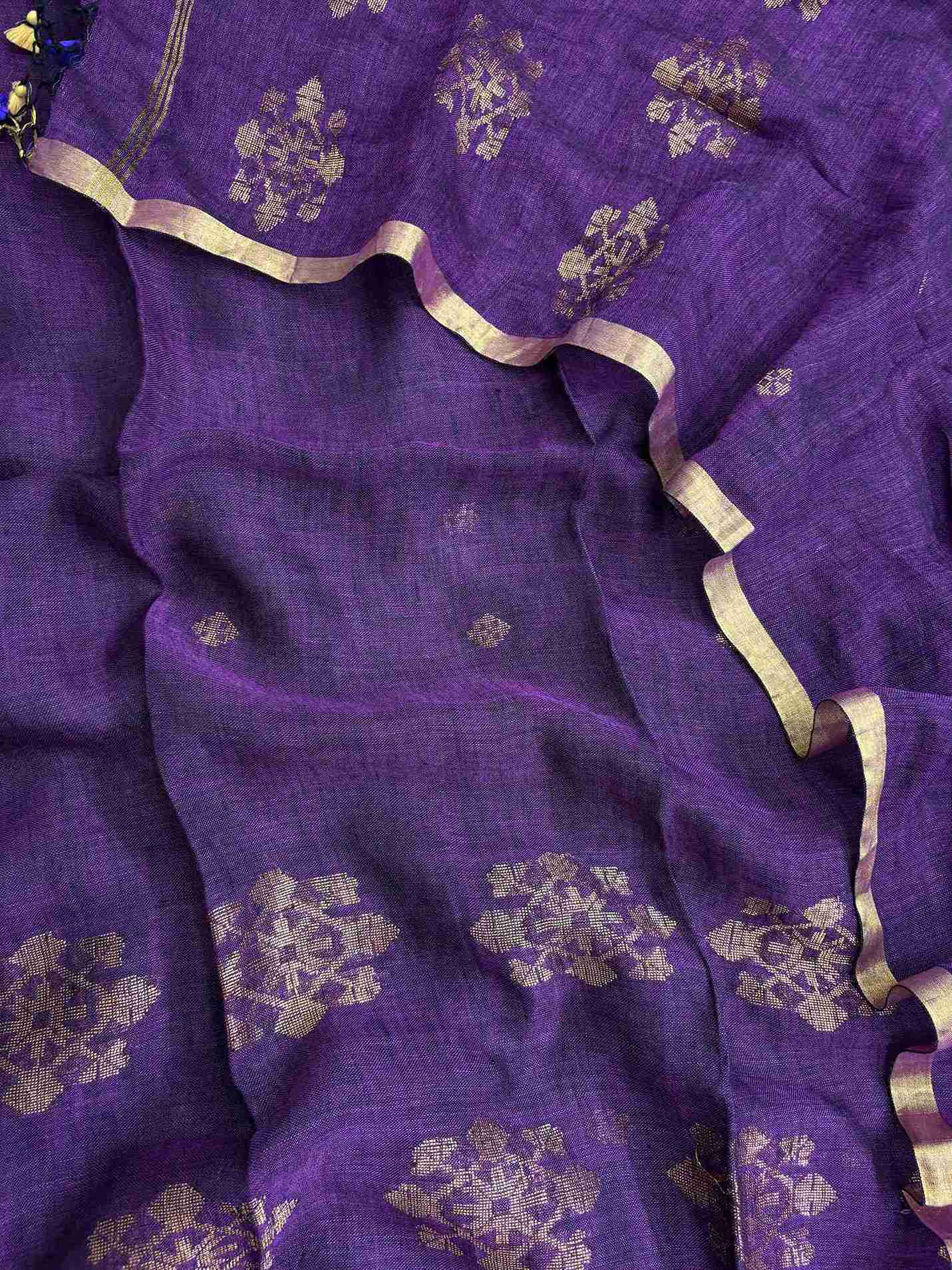 Natural slub texture and organic weave of purple pure handloom linen shirt fabric close-up