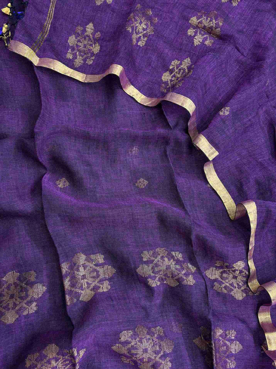 Natural slub texture and organic weave of purple pure handloom linen shirt fabric close-up