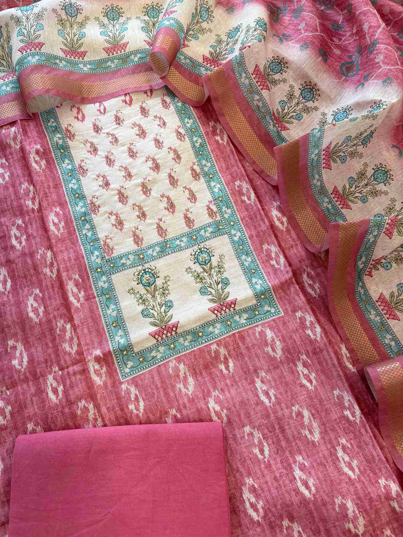 Rose pink Chanderi unstitched suit set flatlay with dupatta and cotton bottom