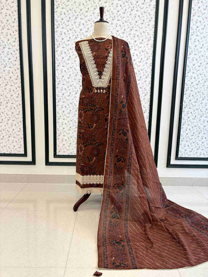 Rust brown cotton unstitched suit full front view with matching printed dupatta draped on mannequin