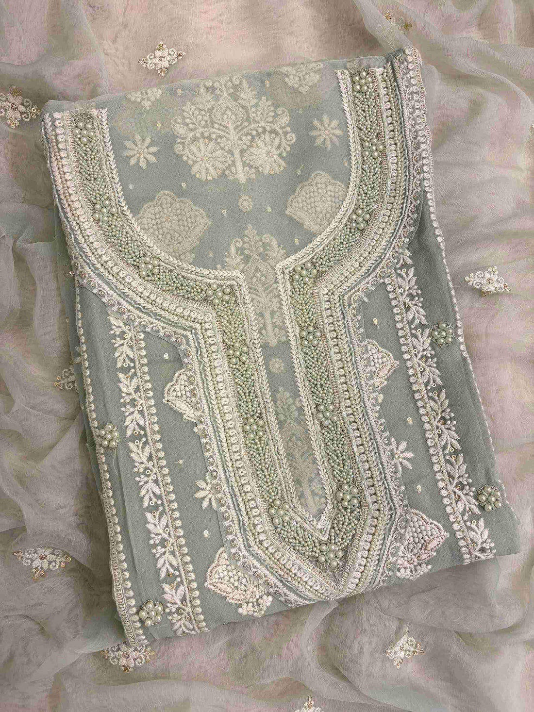 Sage green georgette chikankari suit with moti and bead embellished neckline