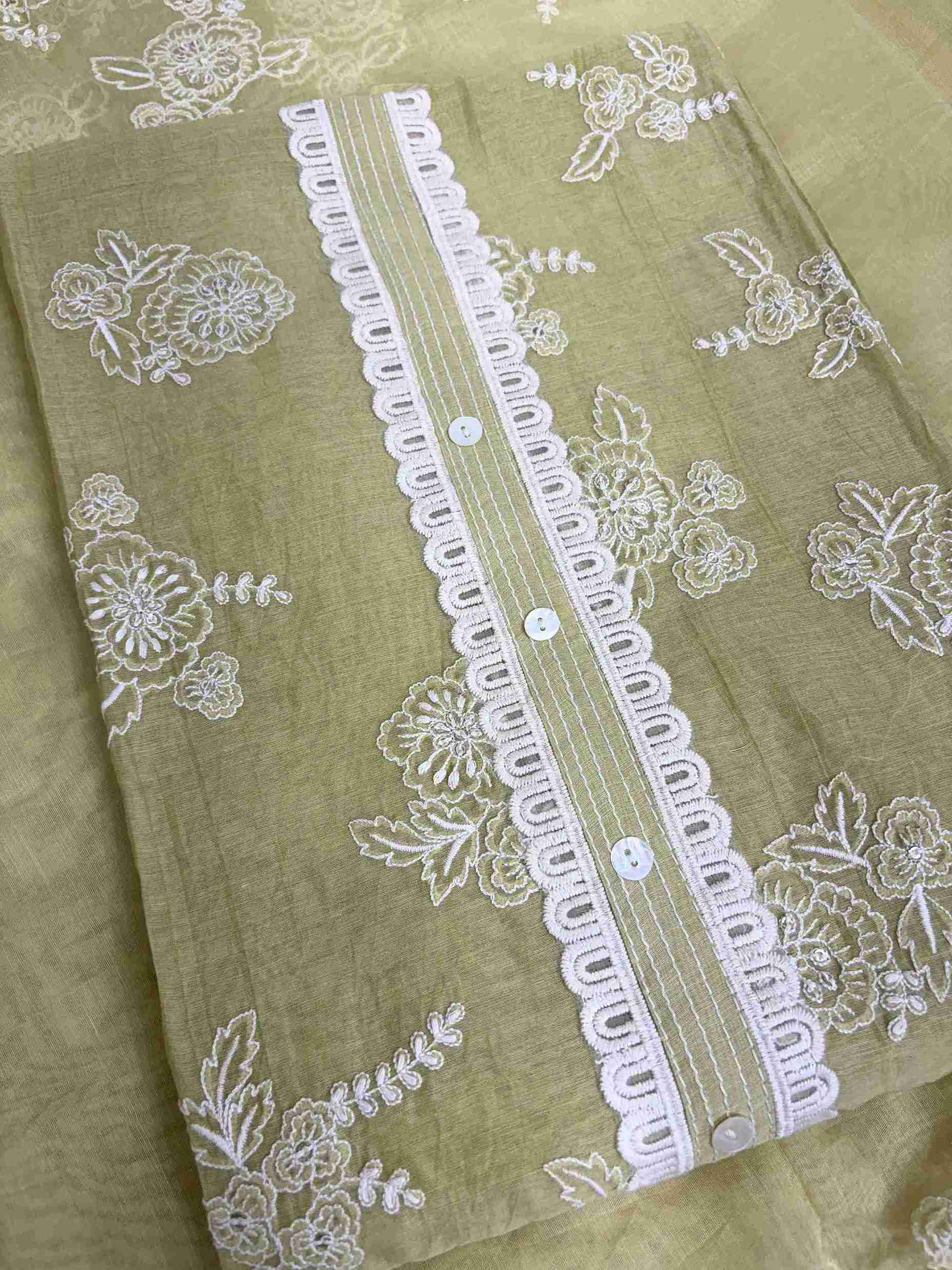 Lace highlighting at neckline and front placket of sage green mul chanderi shirt
