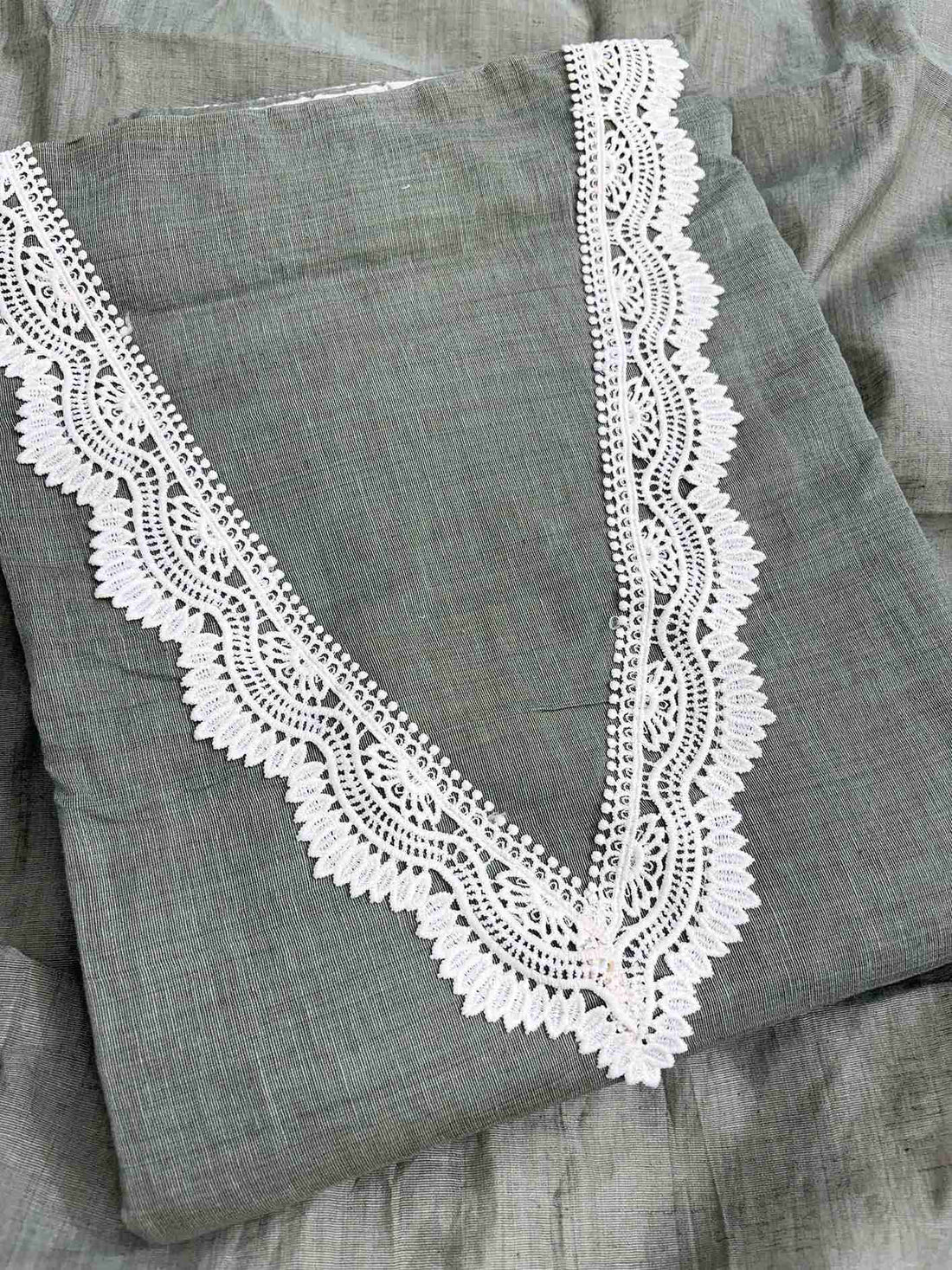 V-neckline detail with crotia lace finishing on sage green mul chanderi shirt
