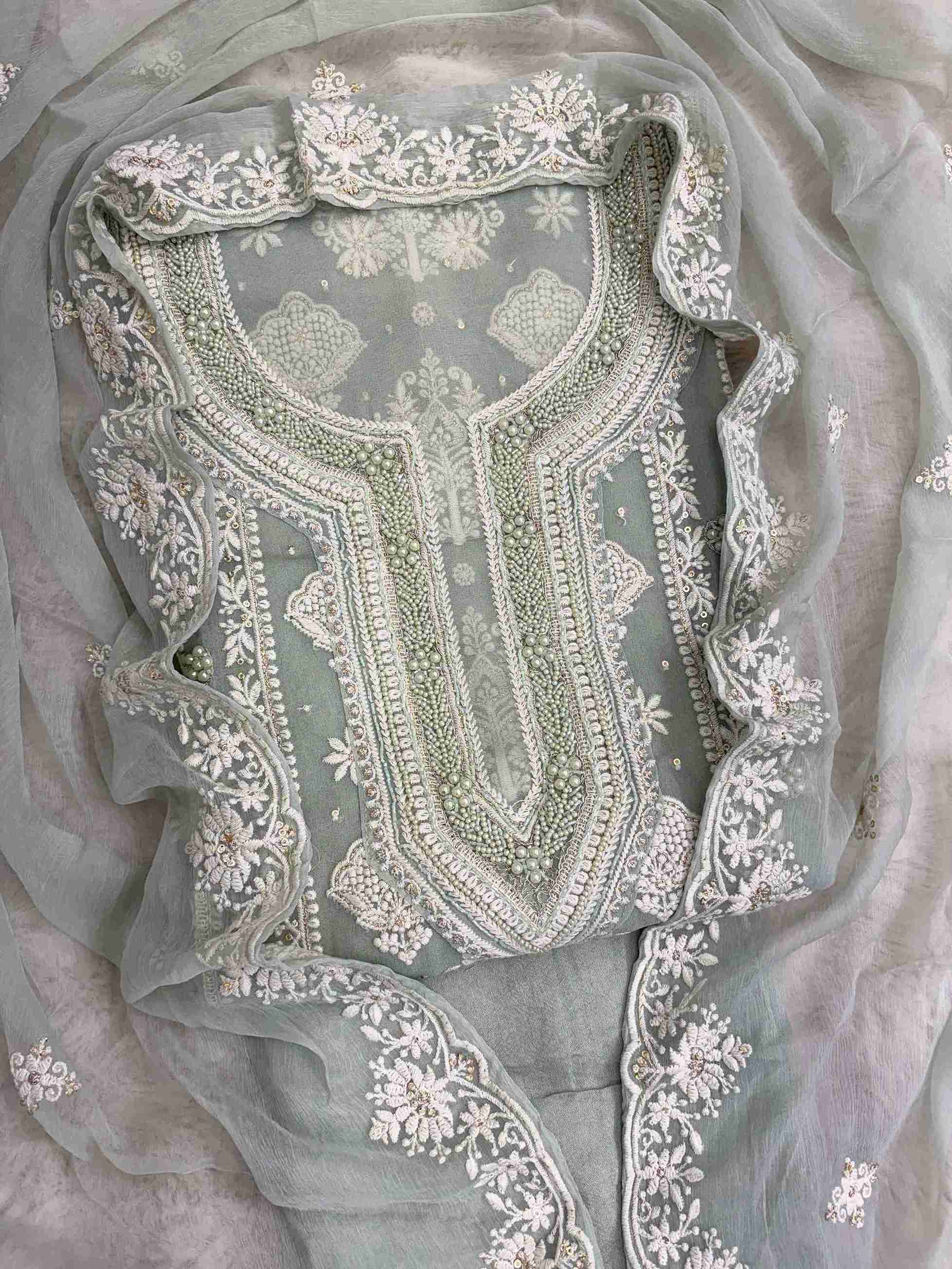 Sage green heavy chikankari wedding wear unstitched suit set front view