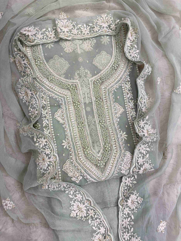 Sage green heavy chikankari wedding wear unstitched suit set front view