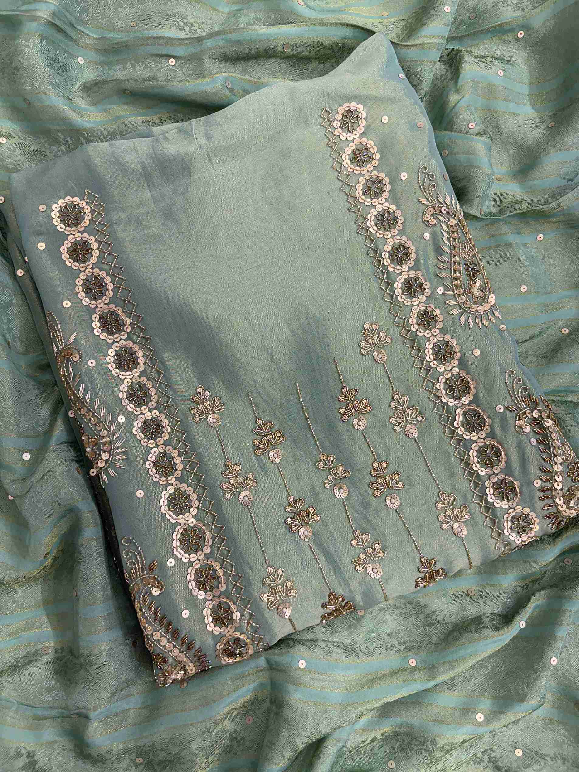 Close up of nalki, sequence and cutdana hand embroidery on sea green shimmer organza shirt
