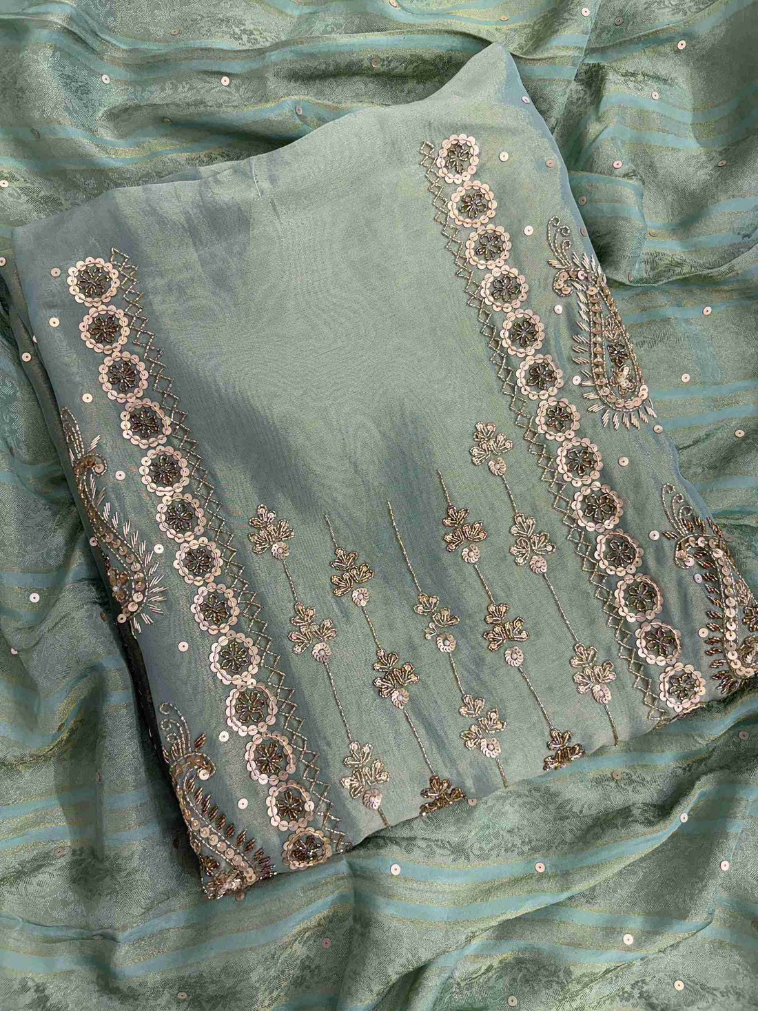 Close up of nalki, sequence and cutdana hand embroidery on sea green shimmer organza shirt