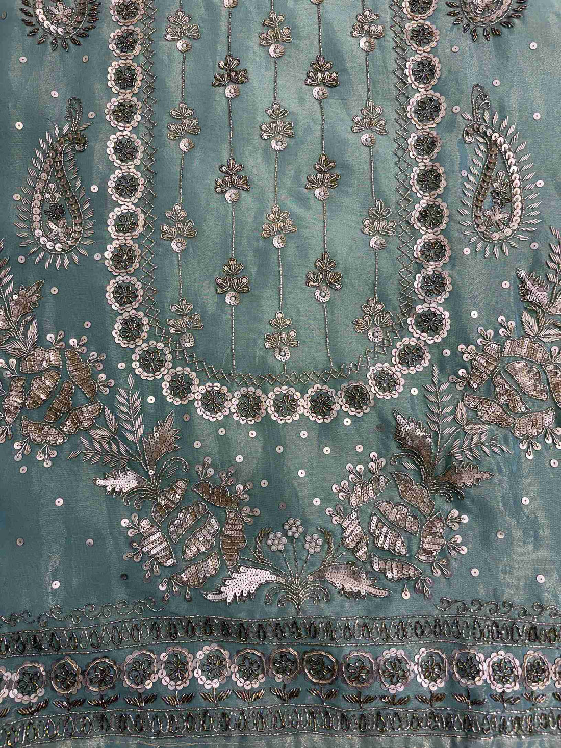 Detailed neckline embroidery with heavy hand nalki and sequence work on shimmer organza