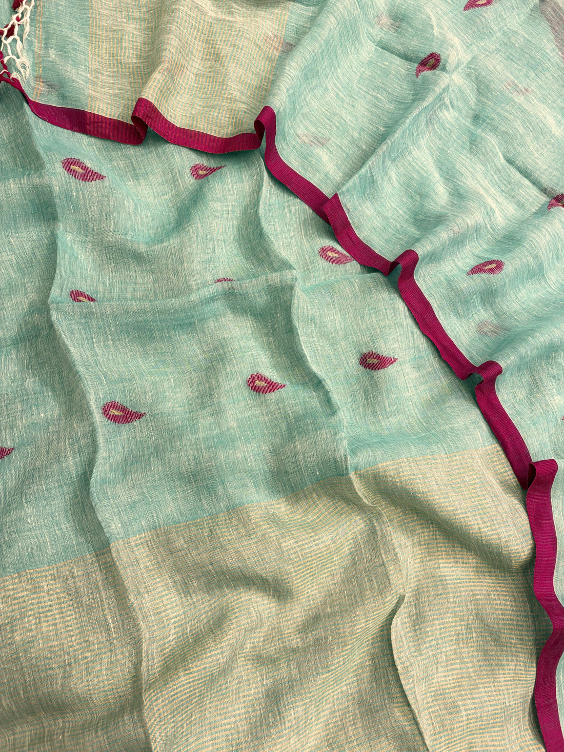 Complete seafoam mint linen unstitched 2-piece suit flat lay with shirt and dupatta showing pink paisley motifs and golden stripe