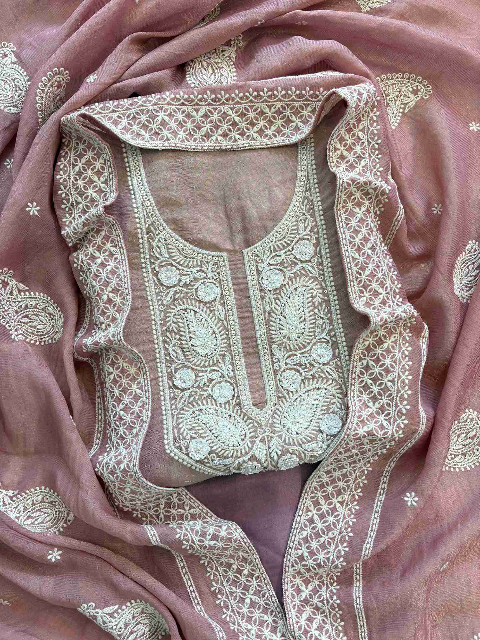 Intricate hand embroidered neckline with white thread work on shimmer tissue fabric kurta
