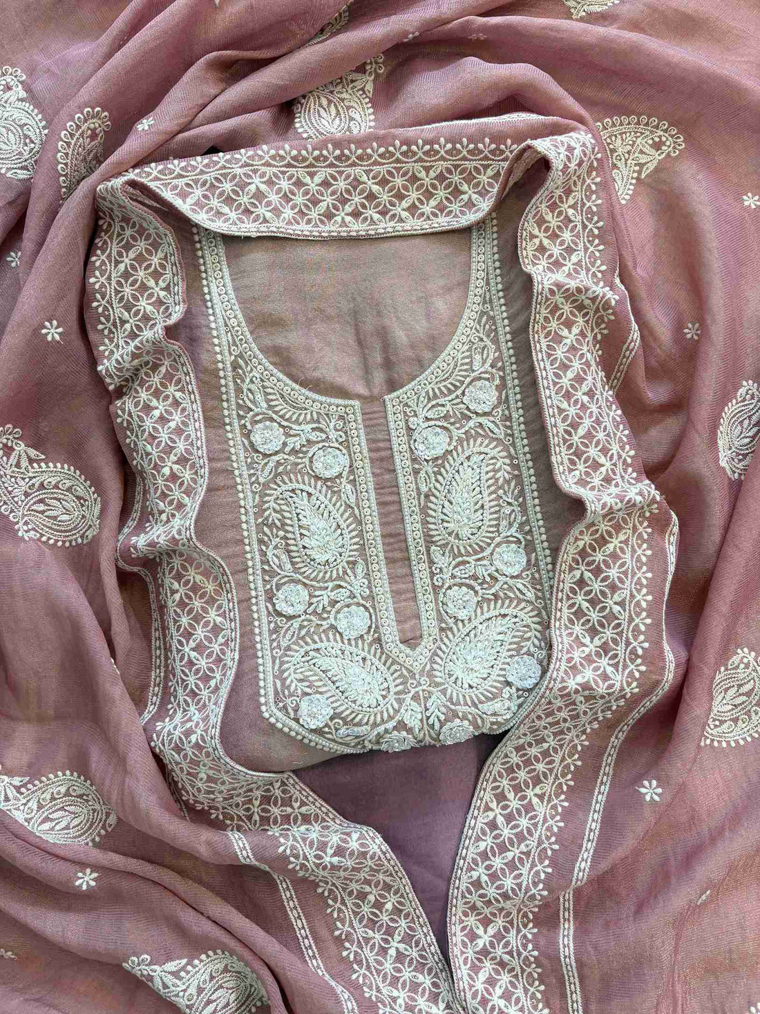Intricate hand embroidered neckline with white thread work on shimmer tissue fabric kurta