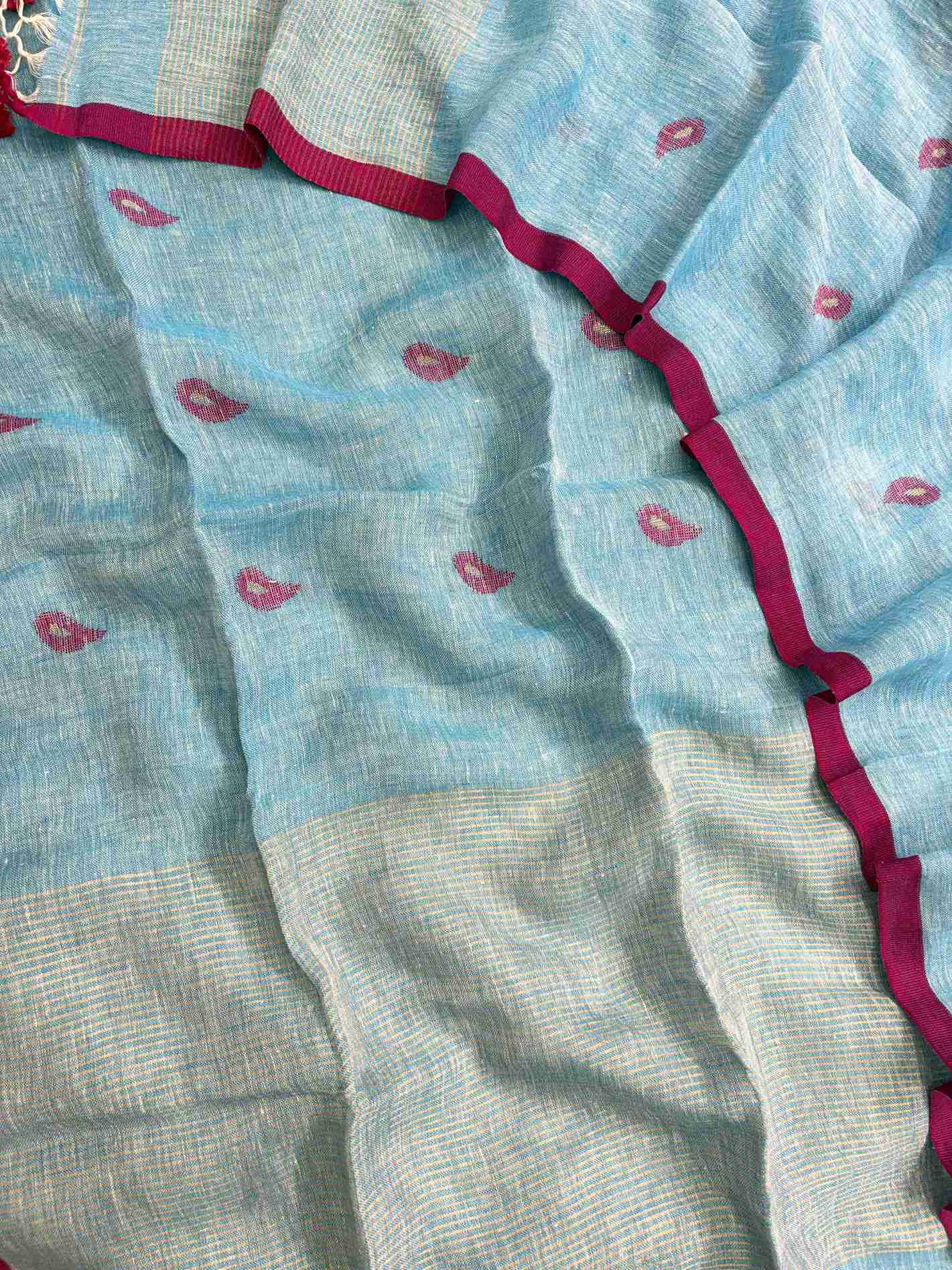 Thin golden stripe band at daaman hemline of sky blue linen unstitched shirt