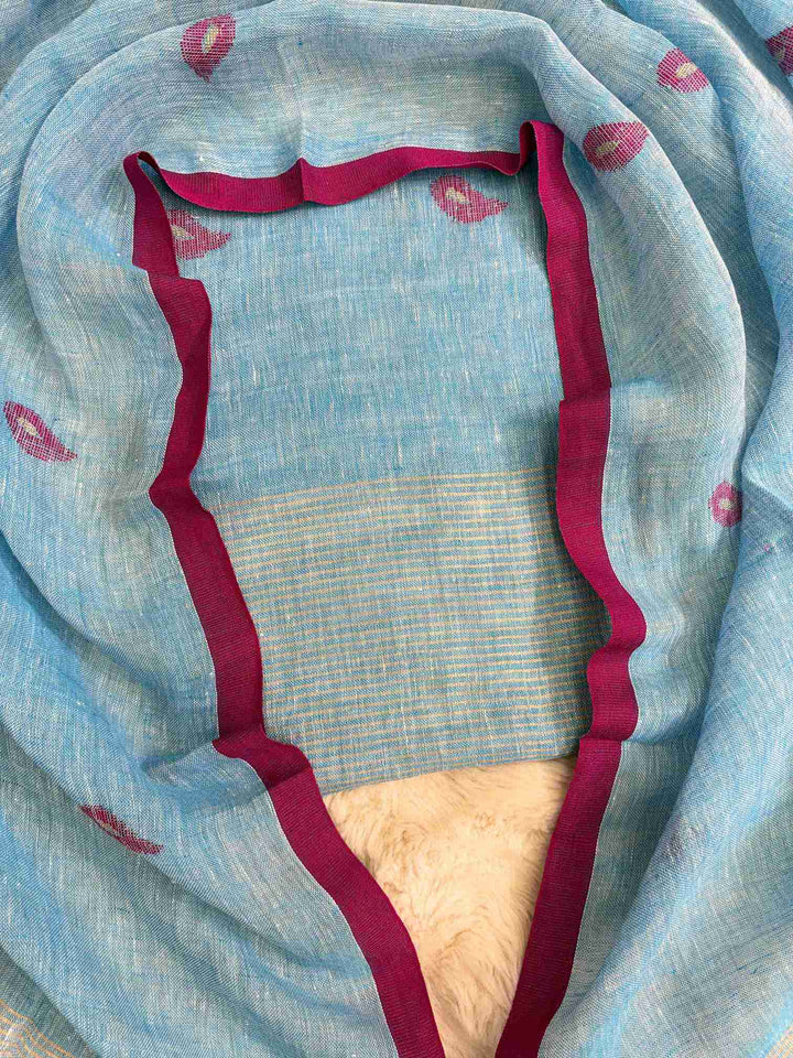 Complete sky blue linen unstitched 2-piece suit flat lay with shirt and dupatta showing pink paisley motifs and golden stripe