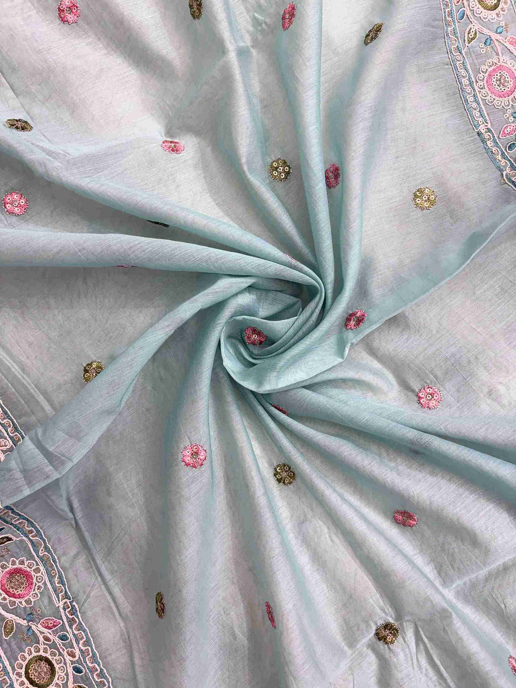 Scattered multicolor thread embroidered floral booties with mirror accents across sky blue mul chanderi dupatta