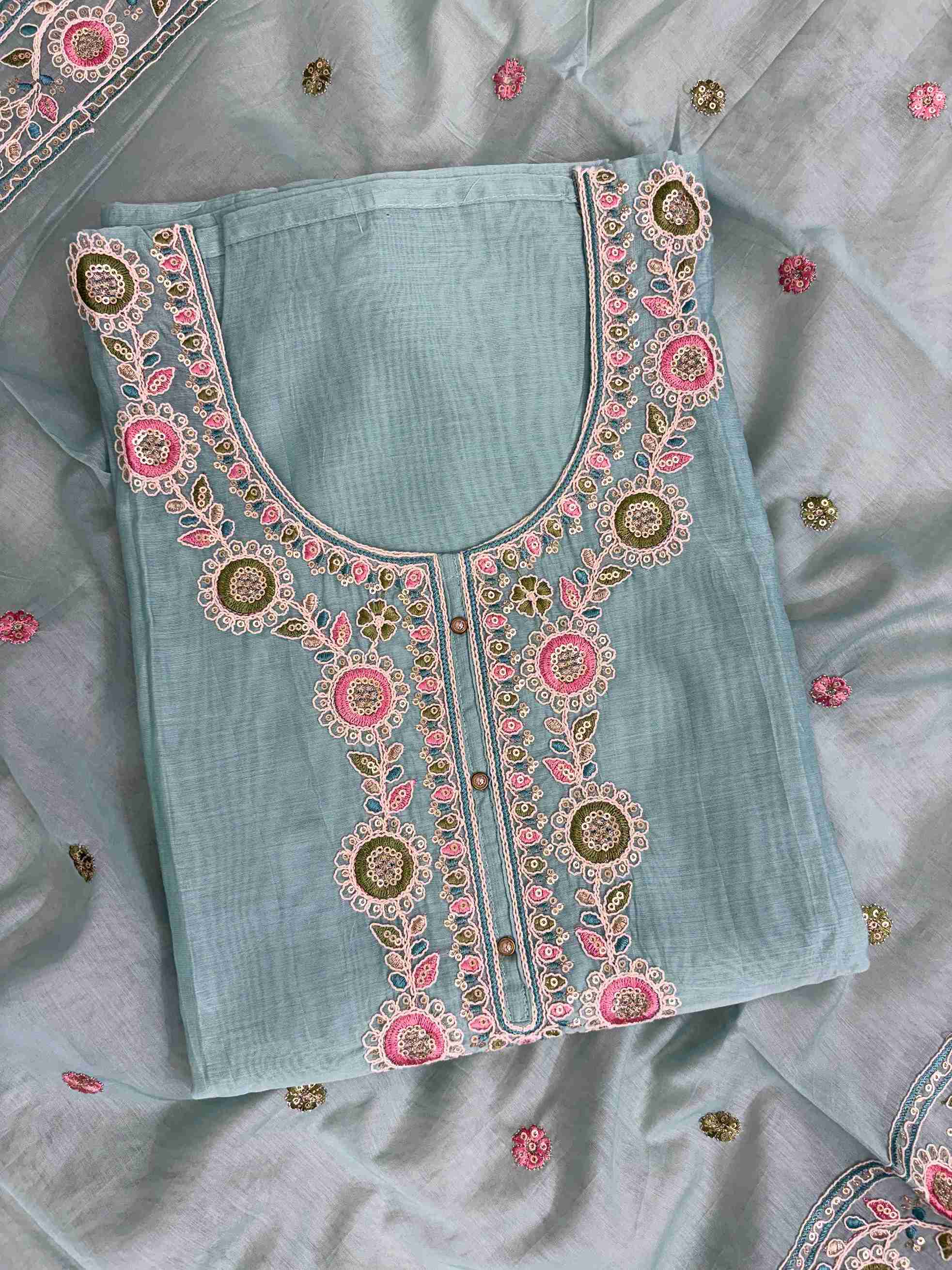 Multicolor thread embroidered floral motifs with mirror work at neckline and front placket of sky blue mul chanderi shirt