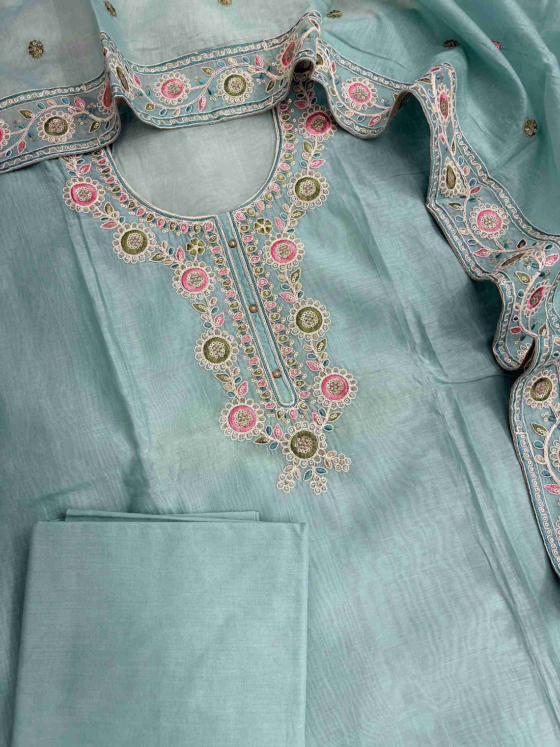 Complete sky blue mul chanderi unstitched suit flat lay set with shirt, dupatta, and matching cotton bottom