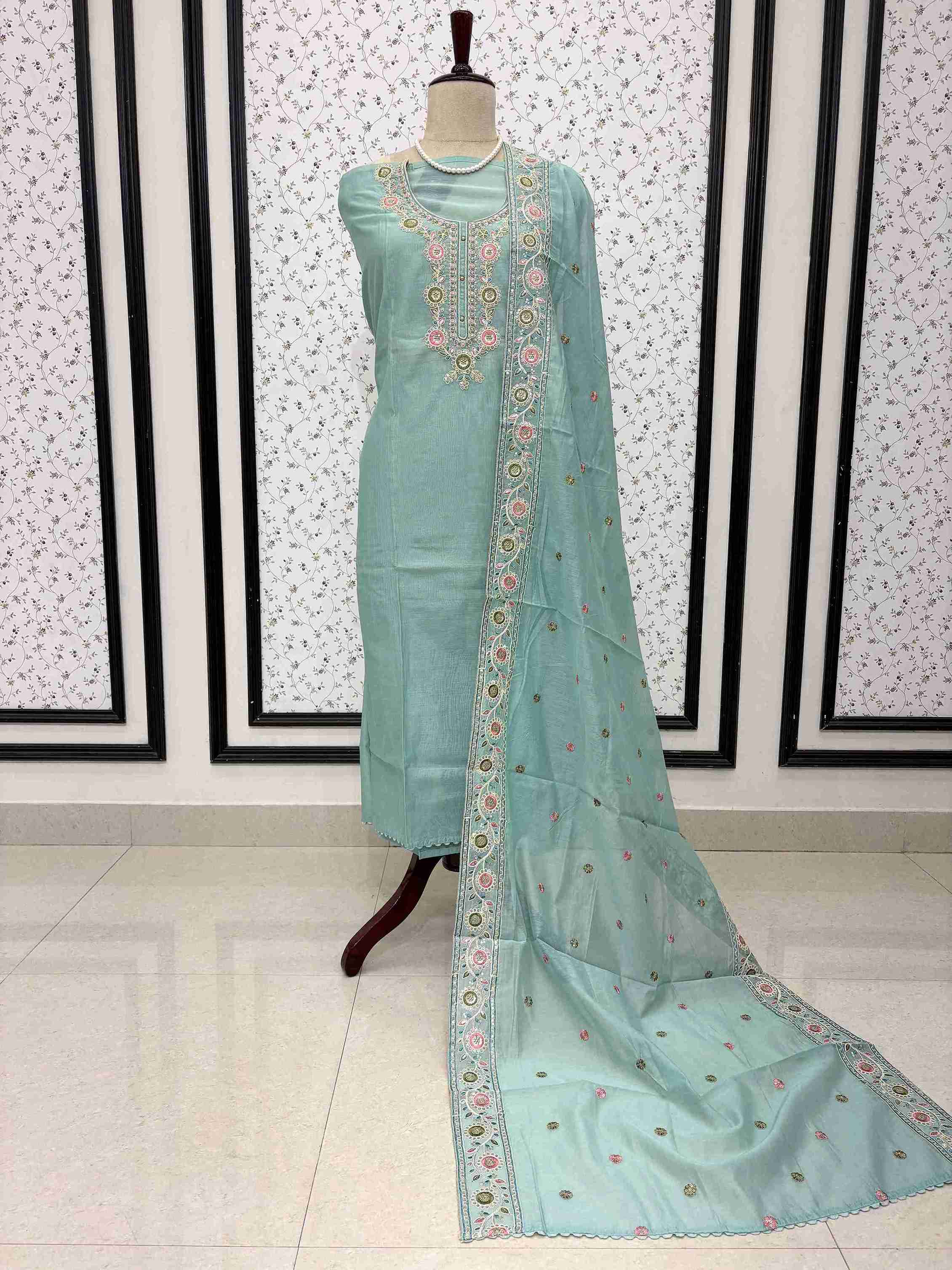 Sky blue mul chanderi unstitched suit full front view with embroidered booty dupatta draped on mannequin