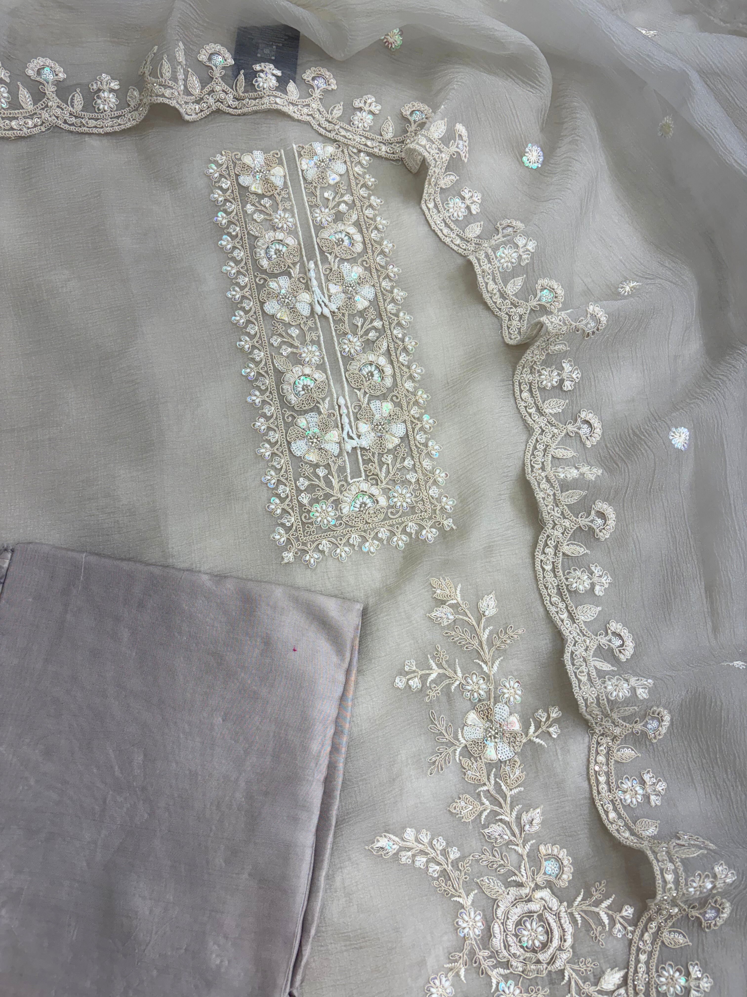 Heavily embroidered rectangular neckline with thread cutdana sequins and beads