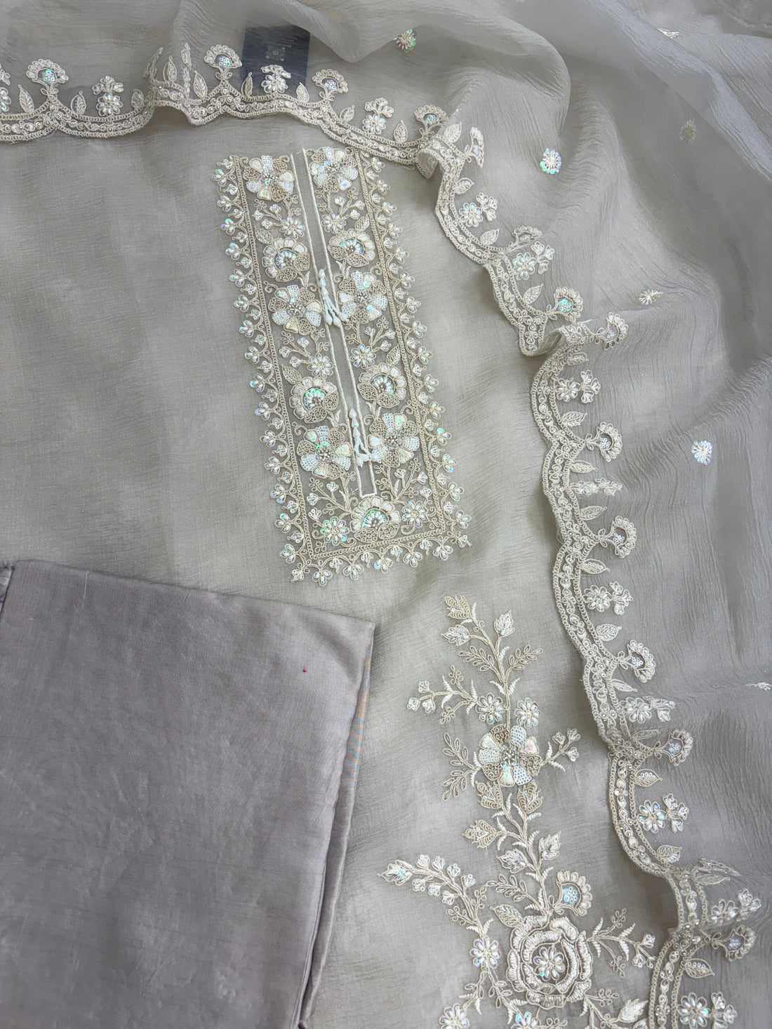 Heavily embroidered rectangular neckline with thread cutdana sequins and beads