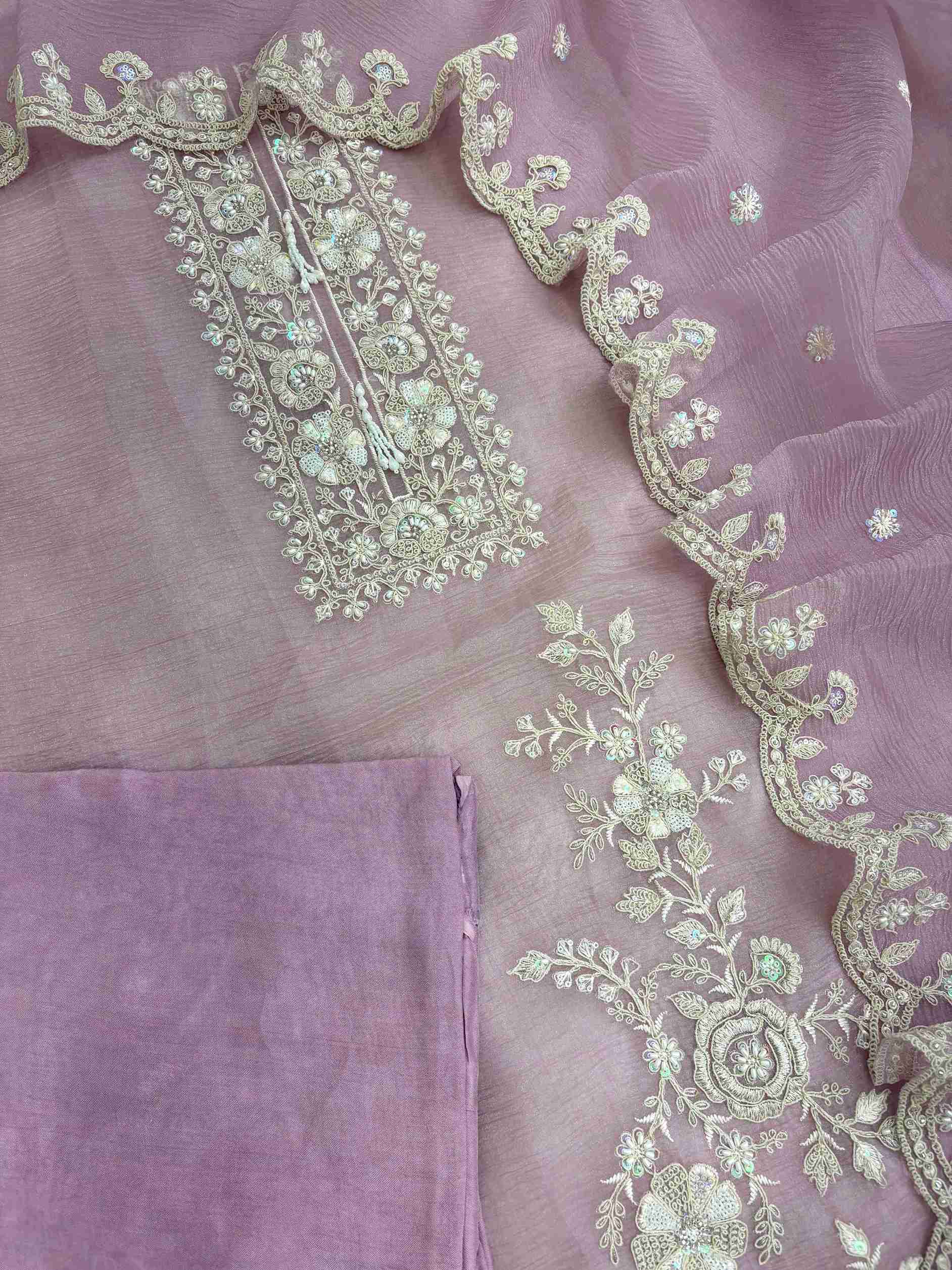 Embroidered shirt border finished with decorative latkans
