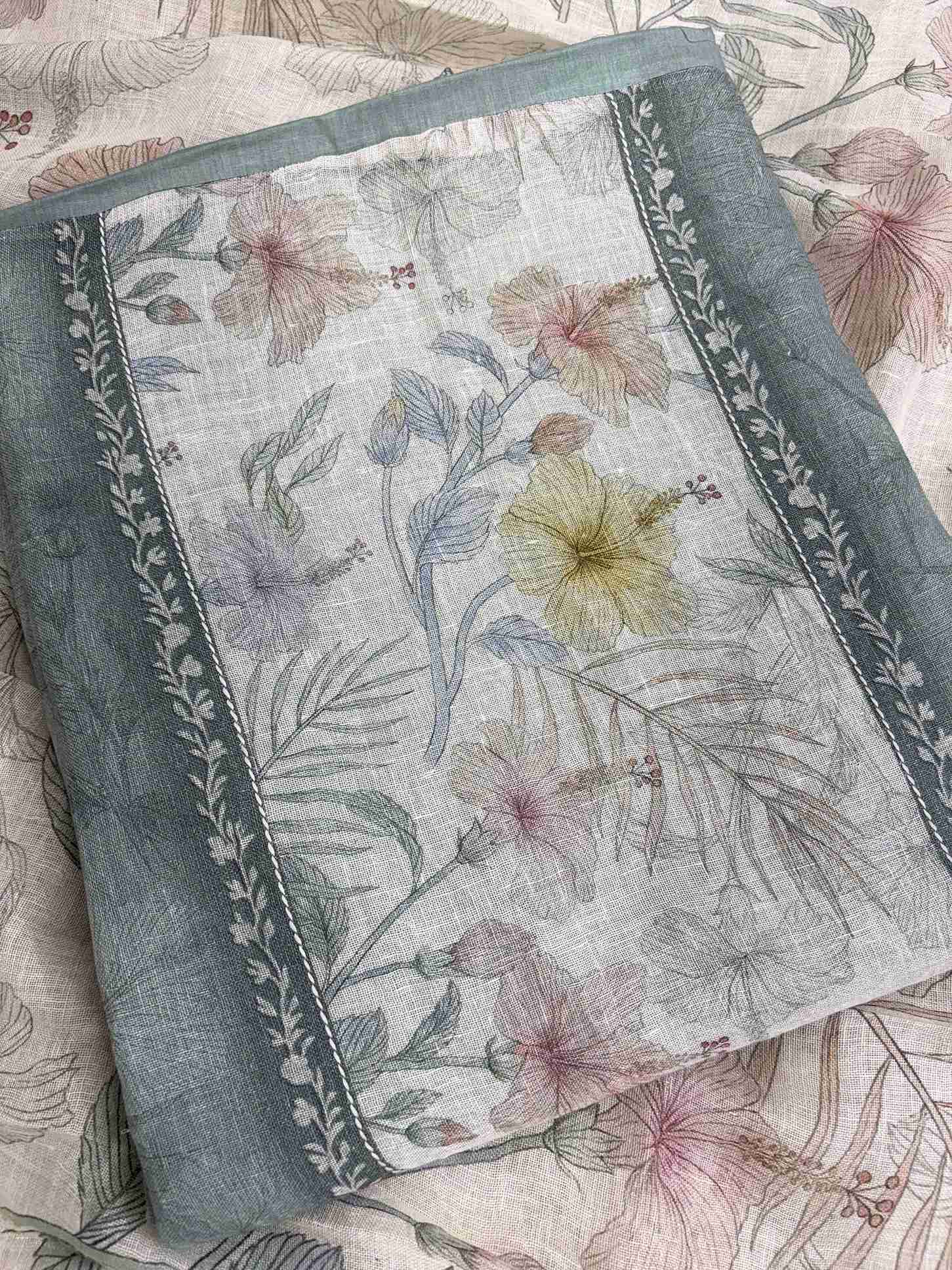 All-over tonal printed texture in soft botanical impressions across soft sage green pure linen shirt body