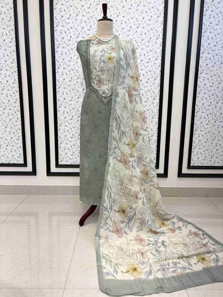 Soft Sage Green pure linen unstitched suit full front view with off-white multicolor floral printed dupatta draped on mannequin