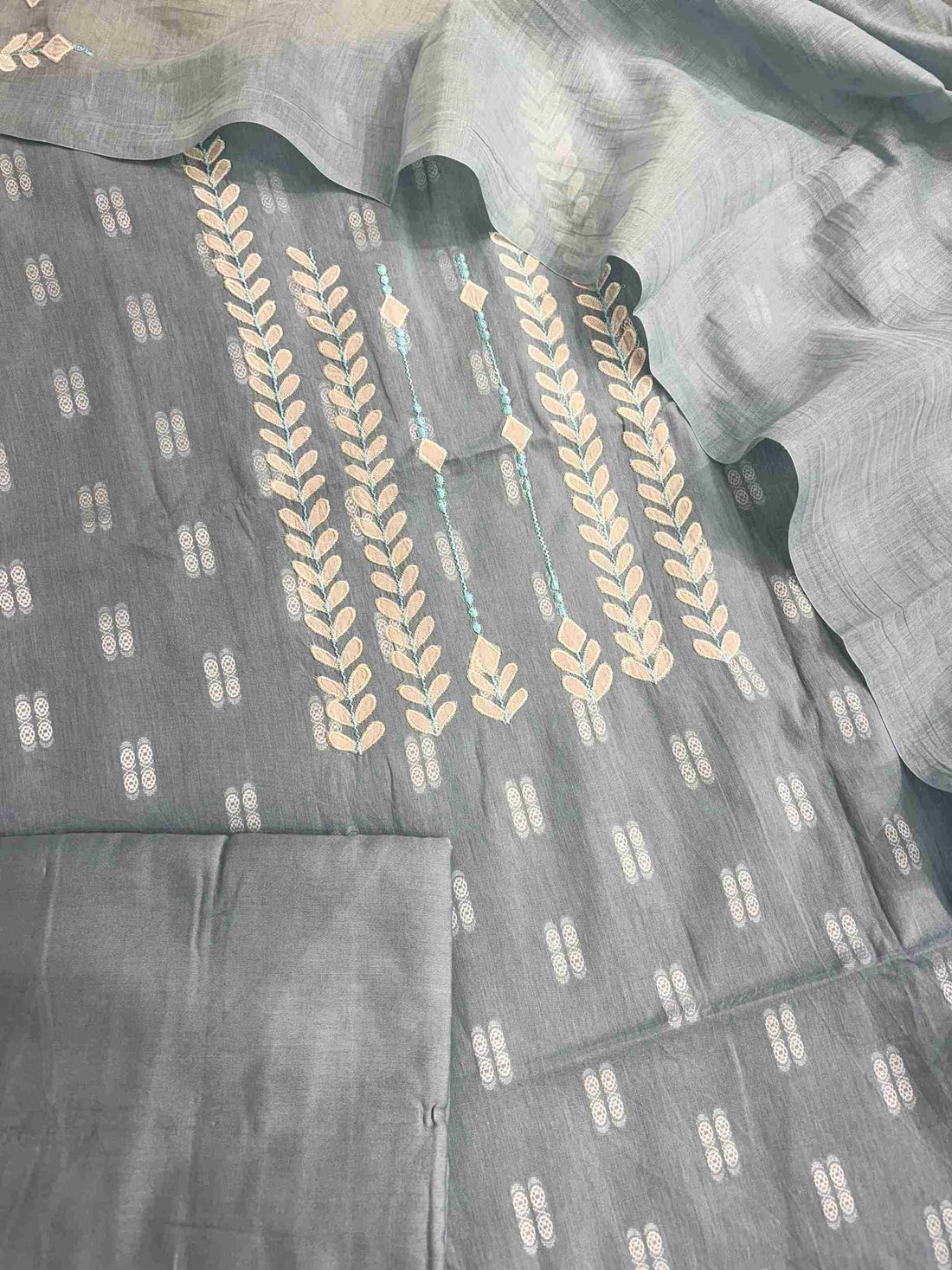 Complete steel blue cotton unstitched suit flat lay set with shirt, mul cotton dupatta, and cotton bottom