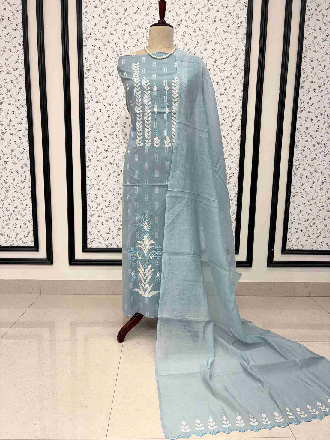 Steel blue cotton unstitched suit full front view with mul cotton cutwork dupatta draped on mannequin