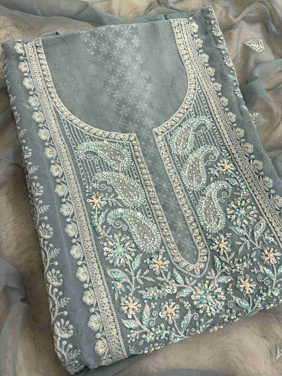Chikankari floral motifs on sleeve of steel blue georgette unstitched shirt
