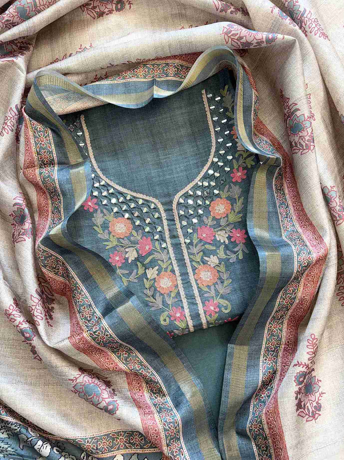 Steel blue tussar silk unstitched suit with mirror and aari work neckline