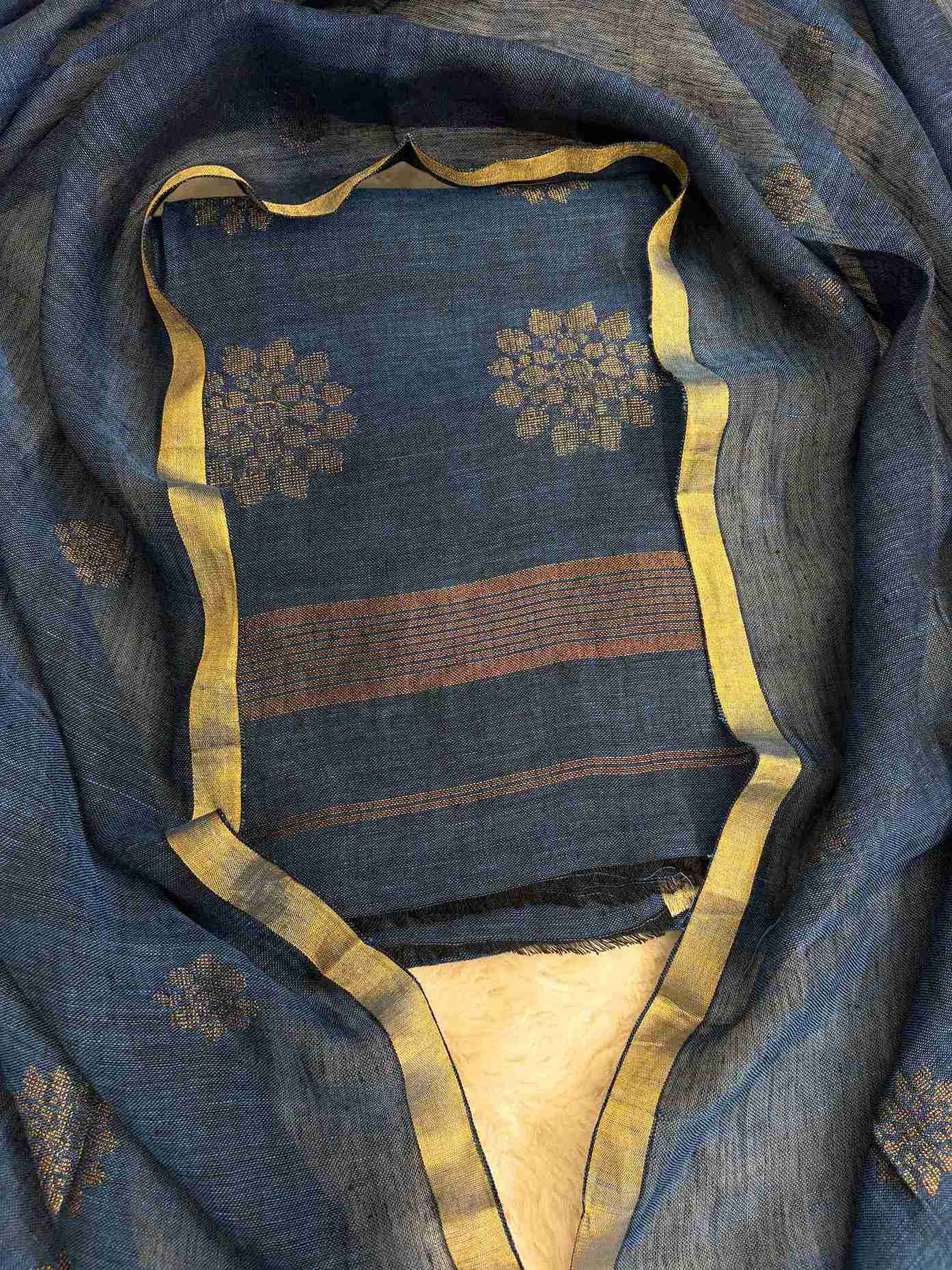 Scattered golden woven floral cluster motifs across teal blue pure handloom linen shirt body