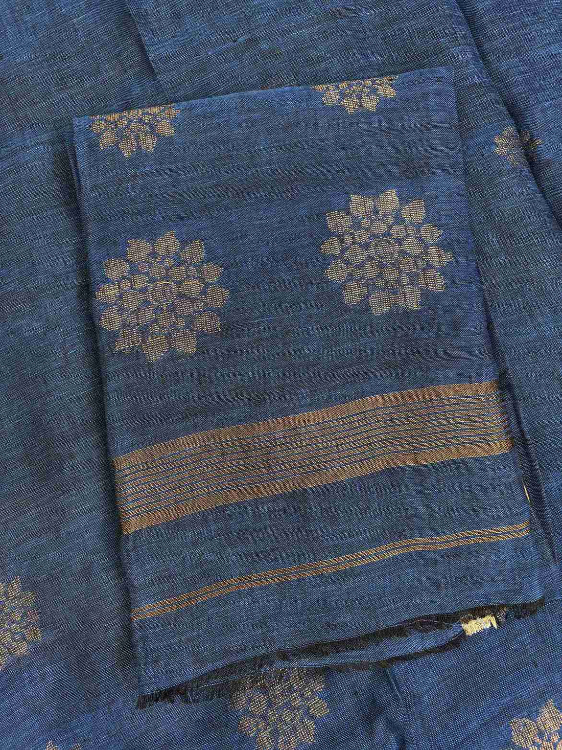  Natural slub texture and organic weave of teal blue pure handloom linen shirt fabric close-up