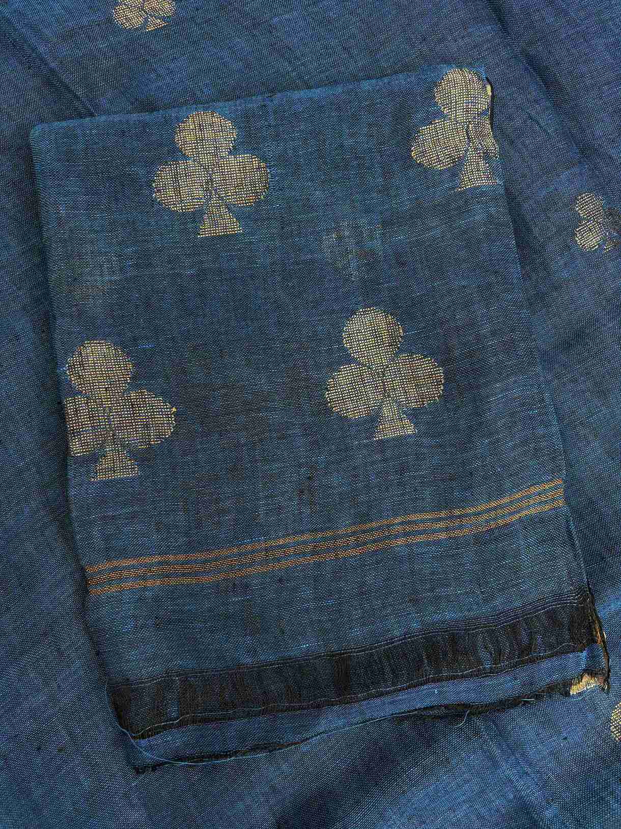 Natural slub texture and organic weave of teal blue pure handloom linen shirt fabric close-up