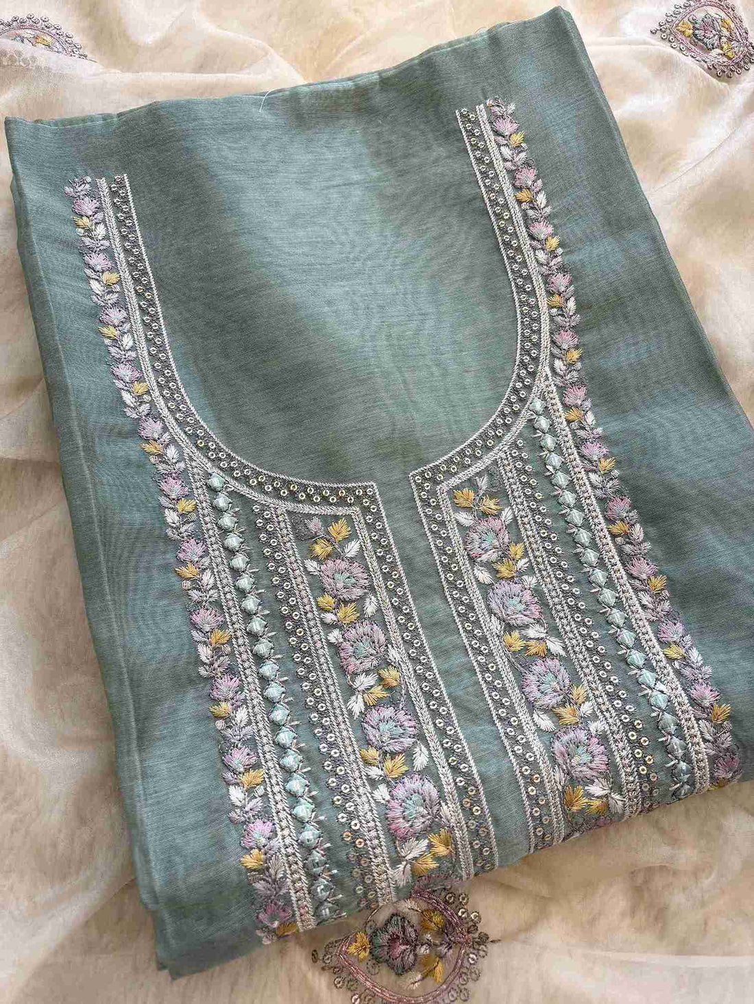Close-up of embroidered neckline on Khaadi Chanderi shirt fabric