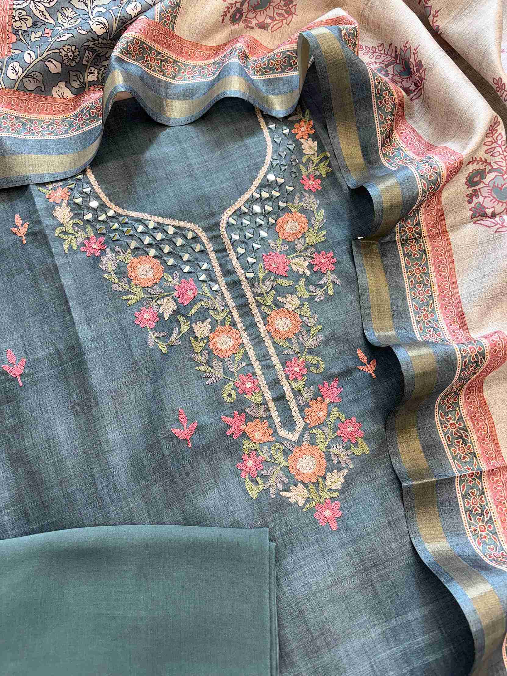 Embroidered floral motifs on steel blue tussar silk shirt fabric