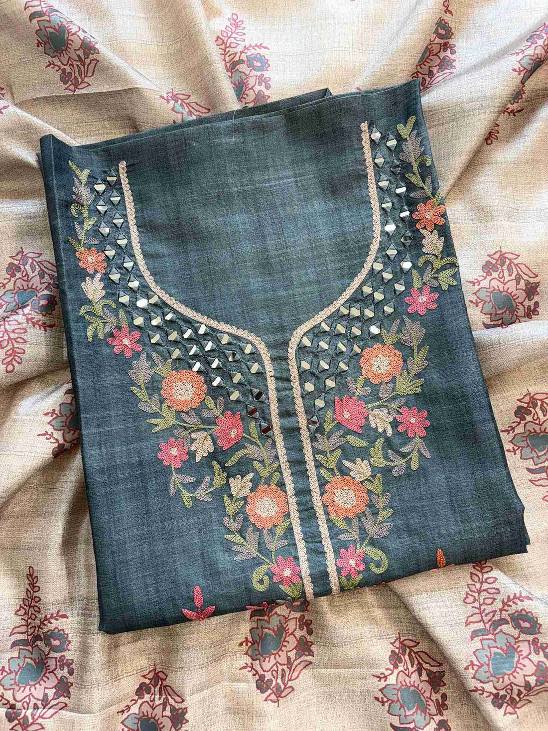 Close-up of mirror and aari embroidered neckline on tussar silk shirt