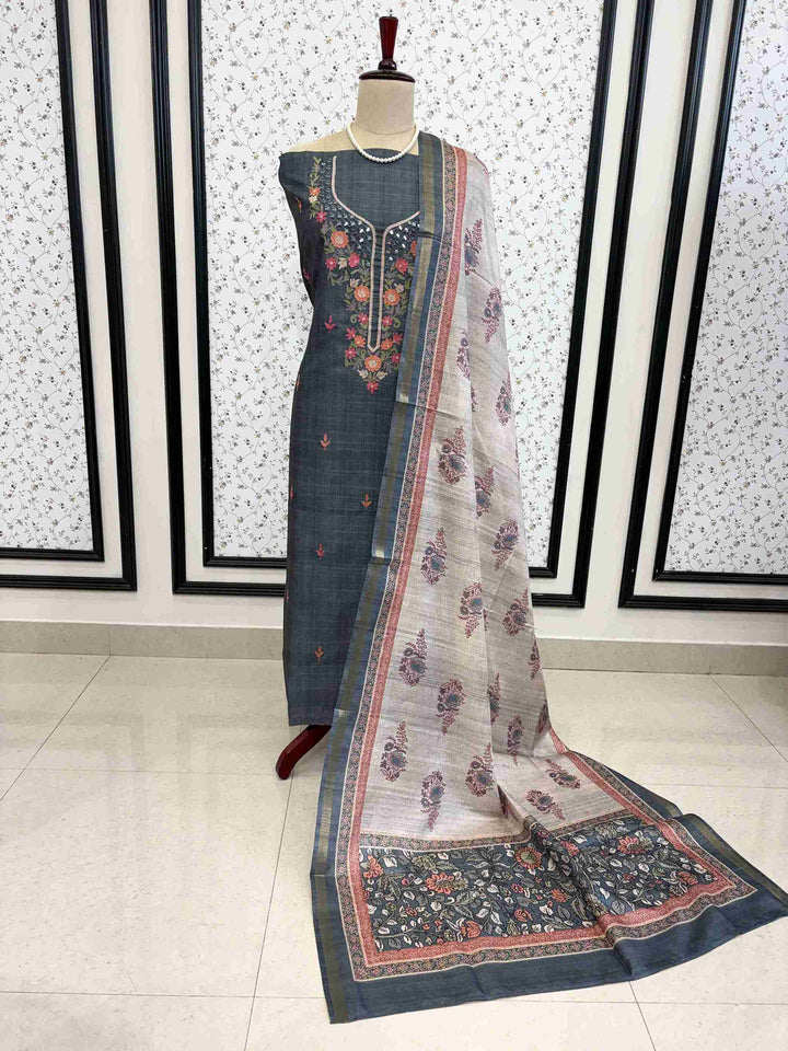Complete unstitched tussar silk suit set with shirt, dupatta and bottom on manequinn