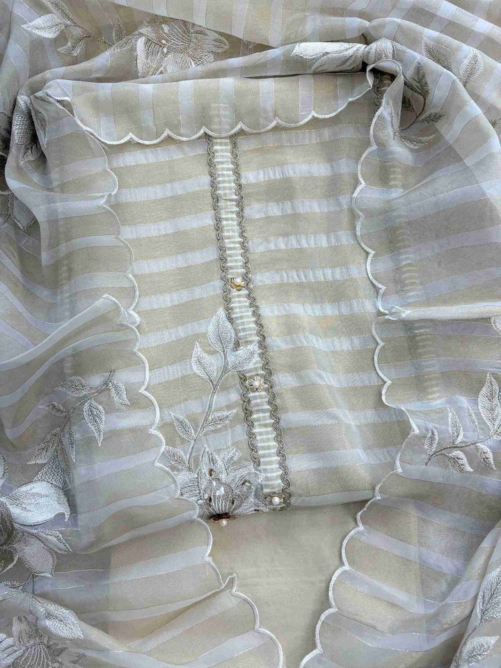 Ivory and gold soft tissue unstitched suit with resham floral motifs and striped dupatta