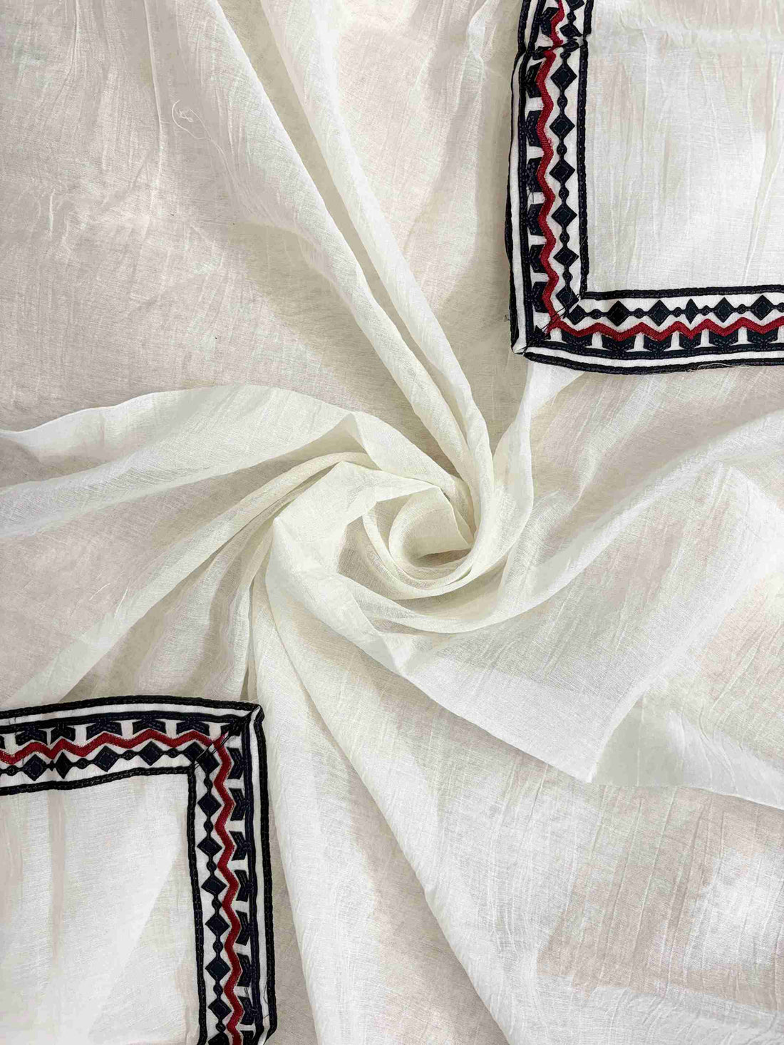 Scattered geometric motifs with black and red geometric border on white mul chanderi dupatta