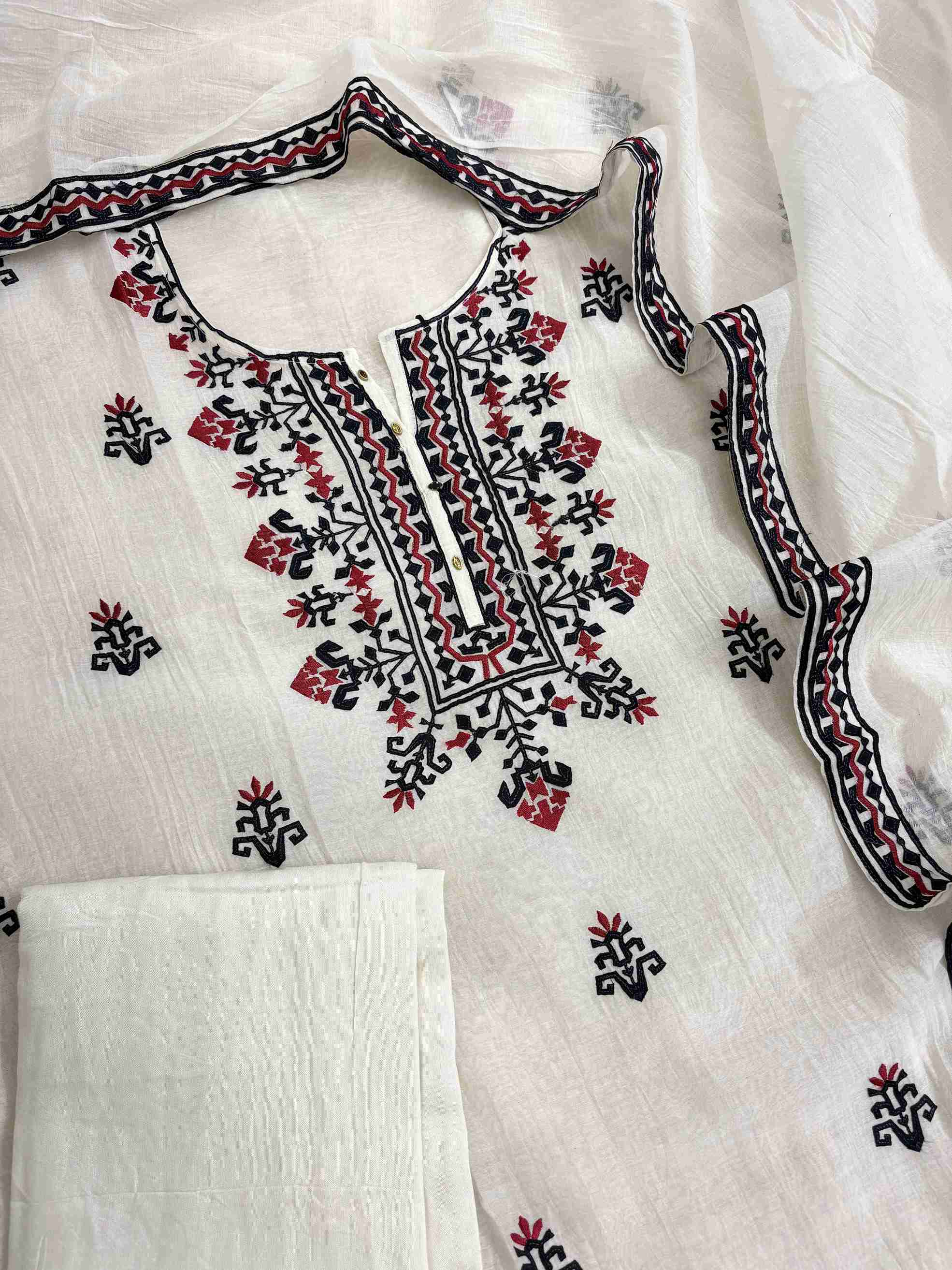 Complete white mul chanderi unstitched suit flat lay set with shirt, dupatta, and cotton silk bottom