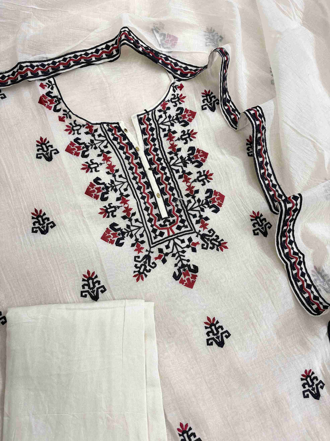 Complete white mul chanderi unstitched suit flat lay set with shirt, dupatta, and cotton silk bottom