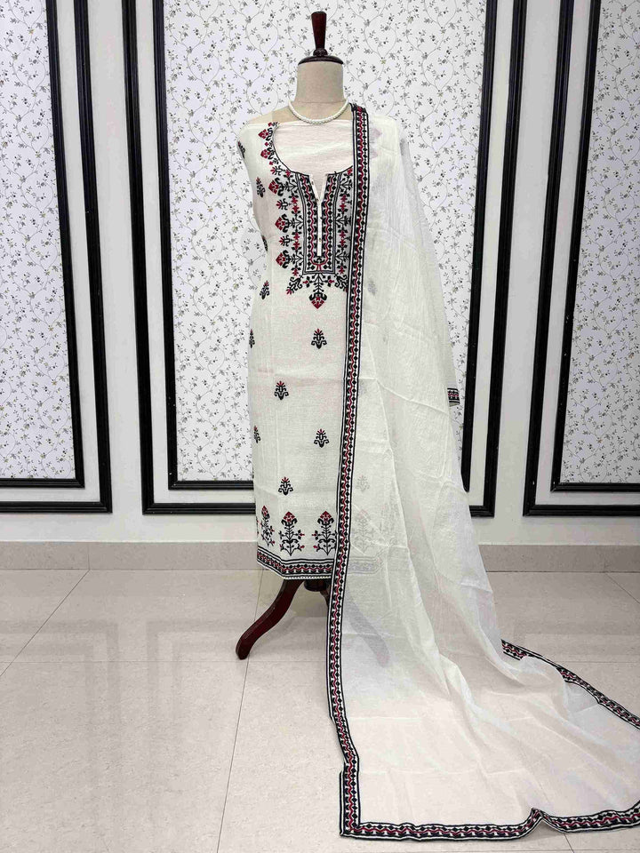 White mul chanderi unstitched suit full front view with geometric border dupatta draped on mannequin