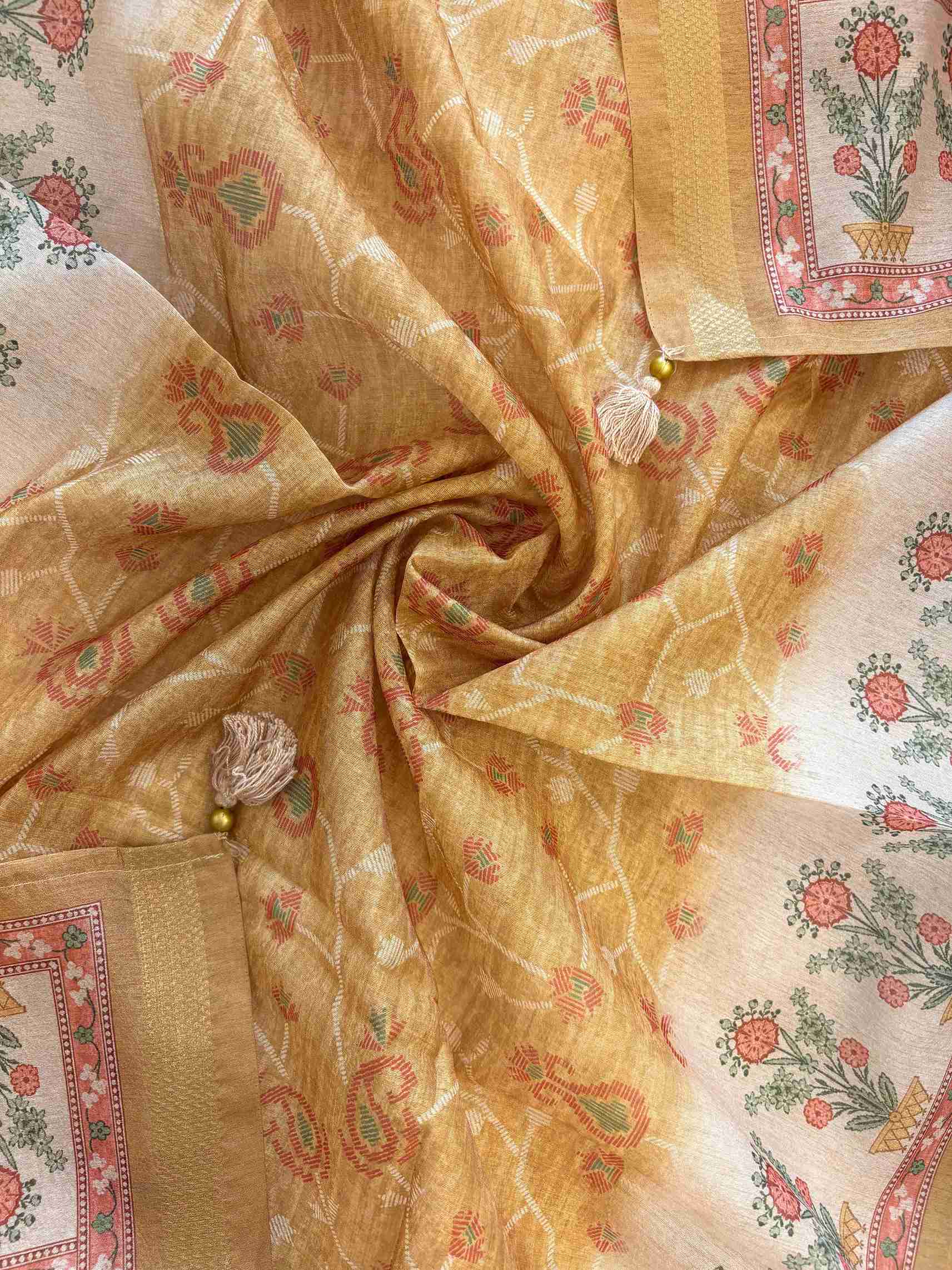 Floral motif print border on the hemline of yellow Chanderi suit
