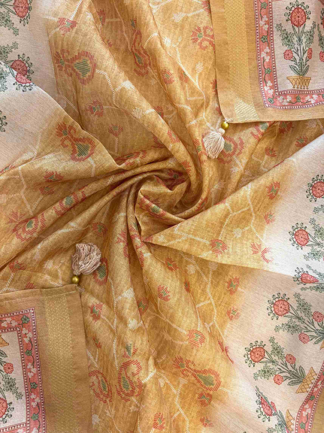 Floral motif print border on the hemline of yellow Chanderi suit